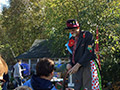 Clown making balloon animals